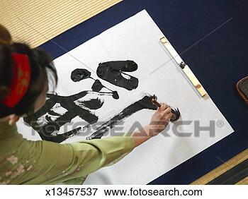 Picture - woman writing 
calligraphy, high 
angle view. fotosearch 
- search stock 
photos, pictures, 
images, and photo 
clipart