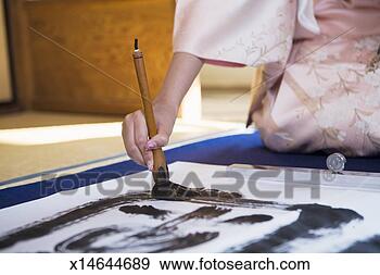 Stock Photograph - woman writing 
calligraphy. fotosearch 
- search stock 
photos, pictures, 
images, and photo 
clipart