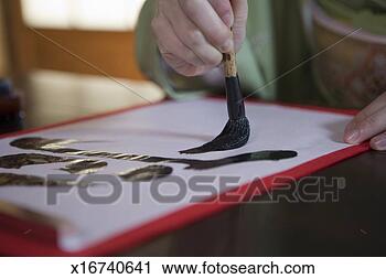 Stock Photography - woman writing 
calligraphy, close 
up of hand. fotosearch 
- search stock 
photos, pictures, 
images, and photo 
clipart
