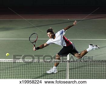 Stock Photo - young man playing 
tennis. fotosearch 
- search stock 
photos, pictures, 
images, and photo 
clipart