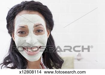 Stock Photo - mid adult woman 
wearing beauty 
mask, portrait, 
close-up. fotosearch 
- search stock 
photos, pictures, 
images, and photo 
clipart