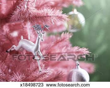 Stock Photo - christmas ornaments 
on pink christmas 
tree, close-up. 
fotosearch - search 
stock photos, 
pictures, images, 
and photo clipart