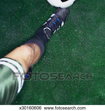 Stock Photo - soccer player 
kicking a soccer 
ball. fotosearch 
- search stock 
photos, pictures, 
images, and photo 
clipart
