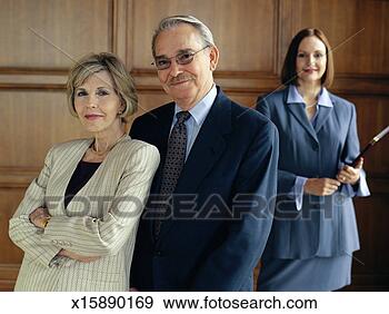 Stock Photograph - senior couple 
in business attire, 
standing in front 
of business woman. 
fotosearch - search 
stock photos, 
pictures, images, 
and photo clipart