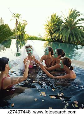 Stock Photo - five women wearing 
face masks in 
hot tub, one wearing 
bridal veil. fotosearch 
- search stock 
photos, pictures, 
images, and photo 
clipart