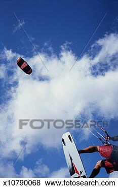 Stock Photo - man kiteboarding, 
low section, low 
angle view. fotosearch 
- search stock 
photos, pictures, 
images, and photo 
clipart