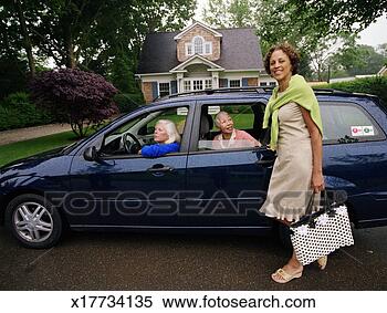 Stock Image - two mature women 
in car, one woman 
standing beside 
it, portrait. 
fotosearch - search 
stock photos, 
pictures, images, 
and photo clipart