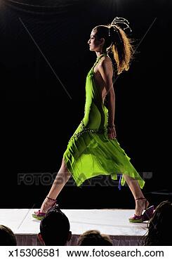 Stock Photography - fashion model 
walking on catwalk 
during fashion 
show, side view. 
fotosearch - search 
stock photos, 
pictures, images, 
and photo clipart