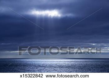 Stock Photo - antarctica, weddell 
sea, sun shining 
through clouds 
over sea. fotosearch 
- search stock 
photos, pictures, 
images, and photo 
clipart