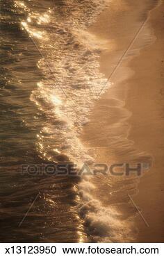 Stock Photography - waves washing 
onto shore, cable 
beach, nassau, 
bahamas. fotosearch 
- search stock 
photos, pictures, 
images, and photo 
clipart