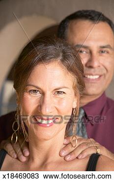 Stock Photo - mature man resting 
hands on mature 
woman's shoulders, 
portrait. fotosearch 
- search stock 
photos, pictures, 
images, and photo 
clipart