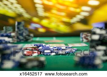 Picture - gambling chips 
on gaming table 
(focus on gambling 
chips). fotosearch 
- search stock 
photos, pictures, 
images, and photo 
clipart