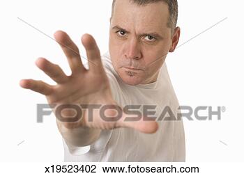 Stock Photo - mature man with 
arm outstretched 
(focus on man's 
face). fotosearch 
- search stock 
photos, pictures, 
images, and photo 
clipart