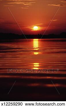 Stock Photography - botswana, okavango 
delta, sunset 
over swamps. fotosearch 
- search stock 
photos, pictures, 
images, and photo 
clipart