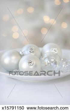 Stock Photography - christmas ornaments 
on glass tray 
(focus on ornaments 
in foreground). 
fotosearch - search 
stock photos, 
pictures, images, 
and photo clipart