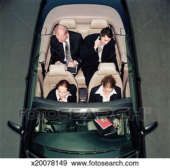 Stock Photograph - four business 
people in open 
top car, elevated 
view. fotosearch 
- search stock 
photos, pictures, 
images, and photo 
clipart