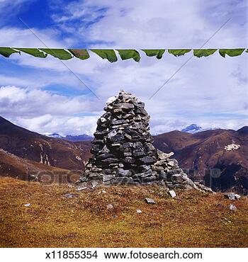 Stock Photo - bhutan, rock stupa 
and prayer flags 
in himalayas. 
fotosearch - search 
stock photos, 
pictures, images, 
and photo clipart