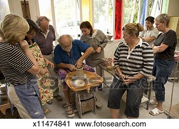 Stock Photography - pottery class 
watching senior 
instructor. fotosearch 
- search stock 
photos, pictures, 
images, and photo 
clipart