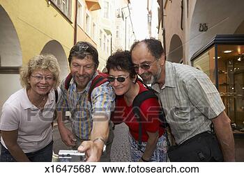 Picture - two mature couples 
smiling for camera 
held by man. fotosearch 
- search stock 
photos, pictures, 
images, and photo 
clipart