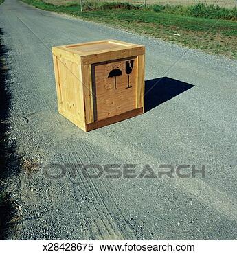 Stock Image - wooden crate with 
'fragile' and 
'do not get wet' 
symbols on road. 
fotosearch - search 
stock photos, 
pictures, images, 
and photo clipart