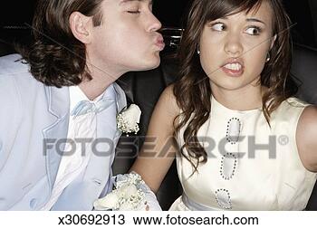 Stock Photo - teenage boy and 
girl (14-16) in 
formalwear, boy 
kissing girl on 
cheek. fotosearch 
- search stock 
photos, pictures, 
images, and photo 
clipart