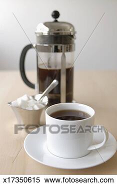 Stock Image - coffee cup, sugar 
cubes and french 
coffee press on 
table. fotosearch 
- search stock 
photos, pictures, 
images, and photo 
clipart