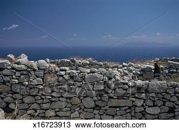 Stock Photo - greece, cyclades, 
santorini, stone 
wall and sea. 
fotosearch - search 
stock photos, 
pictures, images, 
and photo clipart