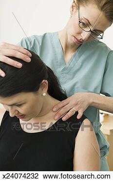 Stock Photo - female chiropractor 
adjusting female 
patient's back. 
fotosearch - search 
stock photos, 
pictures, images, 
and photo clipart