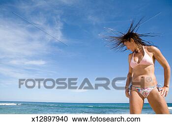 Stock Photography - mexico, baja, 
san jose del cabo, 
woman tossing 
hair on beach, 
smiling. fotosearch 
- search stock 
photos, pictures, 
images, and photo 
clipart