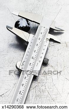 Stock Photo - small globe showing 
antarctica in 
vernier caliper, 
close-up. fotosearch 
- search stock 
photos, pictures, 
images, and photo 
clipart