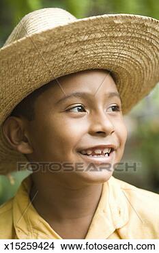 Stock Photo - young boy (9-10) 
in straw hat, 
close-up. fotosearch 
- search stock 
photos, pictures, 
images, and photo 
clipart