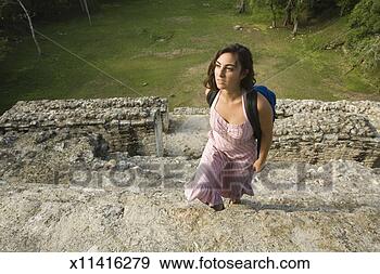 Stock Photograph - young woman visiting 
maya archaeological 
site of lamanai, 
 elevated. fotosearch 
- search stock 
photos, pictures, 
images, and photo 
clipart