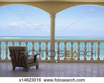 Stock Photo - bahamas, turks 
and caicos islands, 
deck chair on 
balcony and seascape. 
fotosearch - search 
stock photos, 
pictures, images, 
and photo clipart