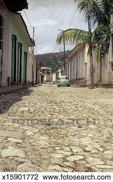 Stock Photo - cuba, trinidad, 
vintage car parked 
on cobblestone 
street. fotosearch 
- search stock 
photos, pictures, 
images, and photo 
clipart