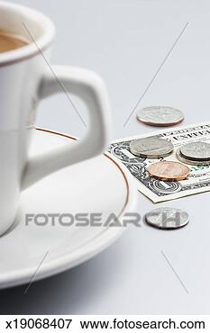 Picture - one us dollar 
banknote and coins 
beside teacup, 
close-up. fotosearch 
- search stock 
photos, pictures, 
images, and photo 
clipart