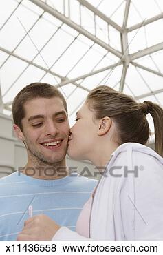 Stock Photo - teenage girl (15-17) 
kissing teenage 
boy (16-18). fotosearch 
- search stock 
photos, pictures, 
images, and photo 
clipart