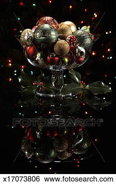 Stock Photo - christmas ornaments 
in glass bowl 
with christmas 
lights in background. 
fotosearch - search 
stock photos, 
pictures, images, 
and photo clipart