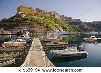 Stock Photo - france, corsica, 
bonifacio marina 
with citadel in 
distance. fotosearch 
- search stock 
photos, pictures, 
images, and photo 
clipart
