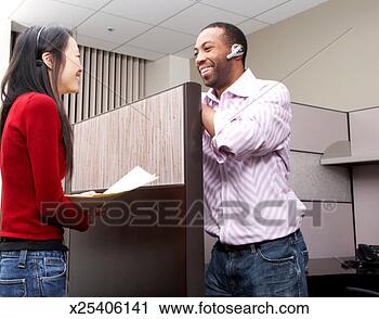 Stock Photography - office workers 
talking to each 
other in office, 
smiling. fotosearch 
- search stock 
photos, pictures, 
images, and photo 
clipart