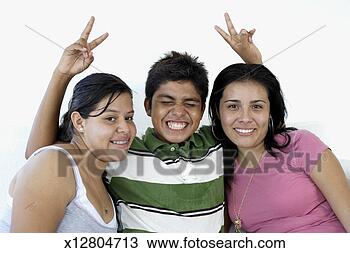 Stock Photo - teenage boy (15-17) 
giving teenage 
girls (15-17) 
rabbit ears. fotosearch 
- search stock 
photos, pictures, 
images, and photo 
clipart