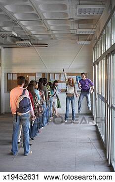 Stock Photography - young adults jumping 
in air by queue 
of young adults. 
fotosearch - search 
stock photos, 
pictures, images, 
and photo clipart