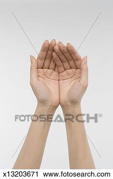 Stock Photography - young woman cupping 
both hands, close-up 
on hands. fotosearch 
- search stock 
photos, pictures, 
images, and photo 
clipart