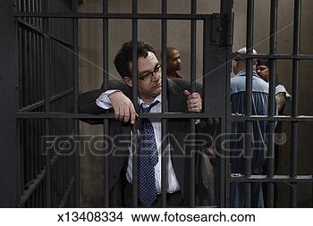 Stock Photo - four men in prison 
cell, one leaning 
against bars. 
fotosearch - search 
stock photos, 
pictures, wall 
murals, images, 
and photo clipart