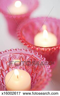 Picture - tea light candles 
in pink glass 
holders. fotosearch 
- search stock 
photos, pictures, 
images, and photo 
clipart