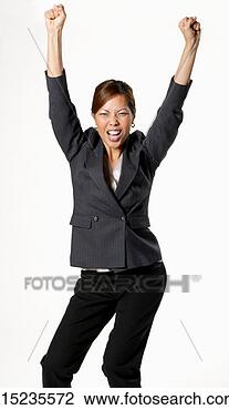 Stock Photo - mid adult businesswoman 
with arms outstretched, 
 pulling facial. 
fotosearch - search 
stock photos, 
pictures, images, 
and photo clipart