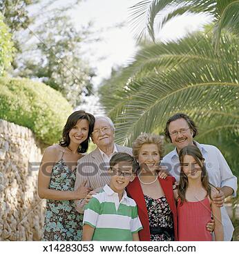 Stock Photo - multi-generation 
family standing 
in garden, smiling, 
portrait. fotosearch 
- search stock 
photos, pictures, 
images, and photo 
clipart