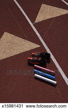 Stock Photography - relay batons and 
sports shoes on 
track, elevated 
view. fotosearch 
- search stock 
photos, pictures, 
images, and photo 
clipart