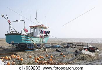 Stock Photo - fishing boat and 
equipment on beach. 
fotosearch - search 
stock photos, 
pictures, images, 
and photo clipart