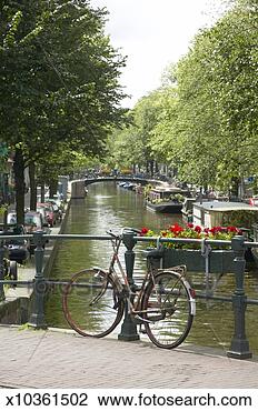 Stock Photo - the netherlands, 
 amsterdam,  bloemgracht, 
 bicycle on bridge. 
fotosearch - search 
stock photos, 
pictures, images, 
and photo clipart