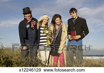 Stock Photograph - teenage boy (14-15), 
 teenage girls 
(16-17) and young 
man at. fotosearch 
- search stock 
photos, pictures, 
images, and photo 
clipart